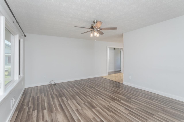 508 Stuart Ave N, Elkton, VA 22827 - unfurnished room with wood finished floors, ceiling fan, and a textured ceiling