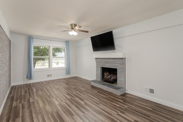 508 Stuart Ave N, Elkton, VA 22827 - unfurnished living room with a fireplace, ceiling fan, and wood finished floors