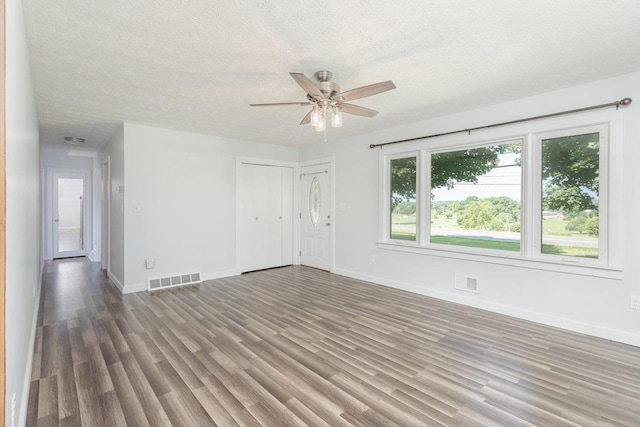 508 Stuart Ave N, Elkton, VA 22827 - empty room featuring wood finished floors, a ceiling fan, and a textured ceiling
