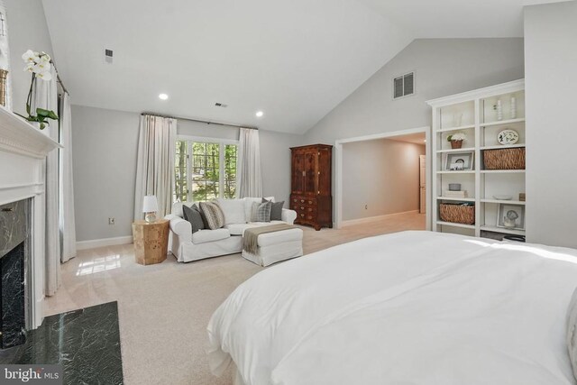  - bedroom with a high end fireplace, carpet flooring, vaulted ceiling, baseboards, and recessed lighting
