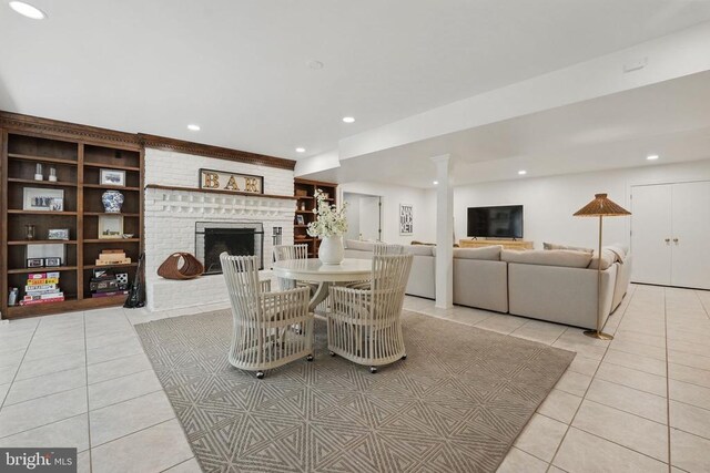  - dining space with light tile patterned flooring, a fireplace, and recessed lighting