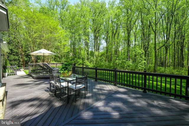  - deck featuring outdoor dining area