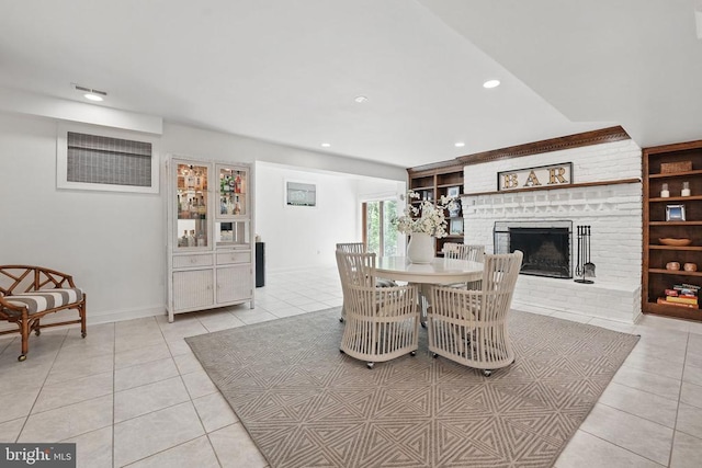  - dining space with light tile patterned flooring, recessed lighting, a fireplace, and baseboards
