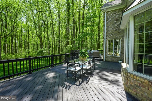  - wooden deck featuring outdoor dining space