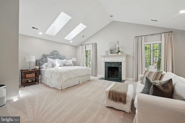  - bedroom with a skylight, lofted ceiling, carpet floors, a fireplace, and recessed lighting