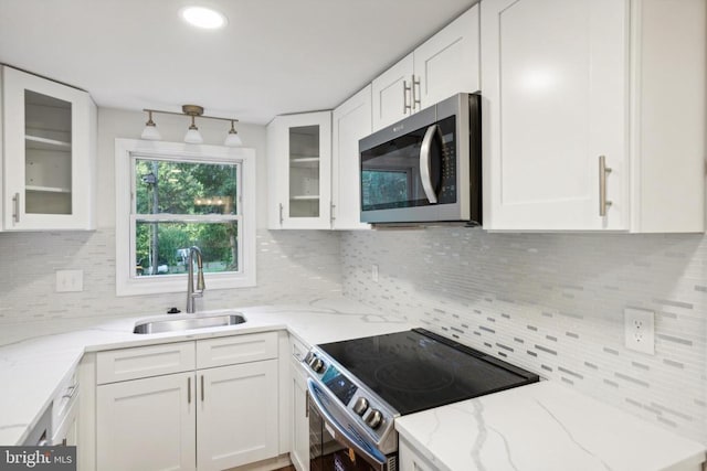 10443 Settle School Rd, Rixeyville, VA 22737 - kitchen featuring appliances with stainless steel finishes, a sink, decorative backsplash, and white cabinets