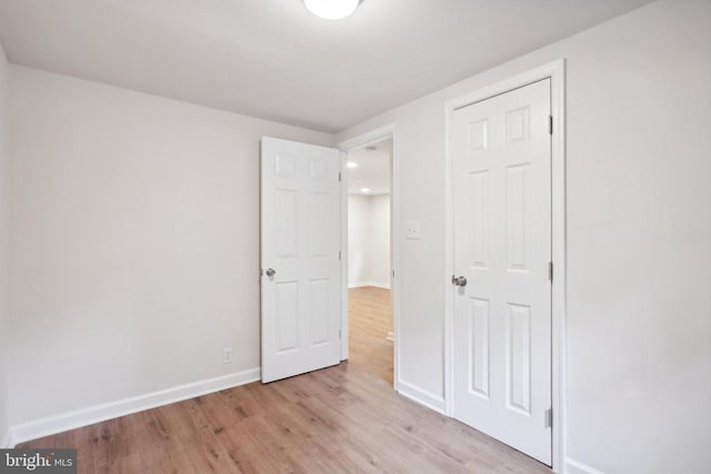 10443 Settle School Rd, Rixeyville, VA 22737 - unfurnished bedroom with light wood-type flooring and baseboards