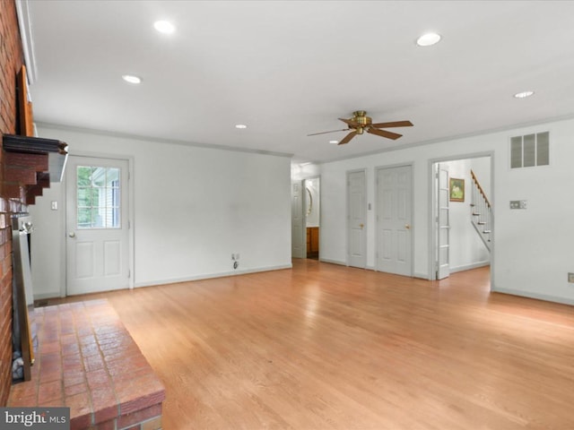  - unfurnished living room featuring stairs, ceiling fan, recessed lighting, and light wood-type flooring