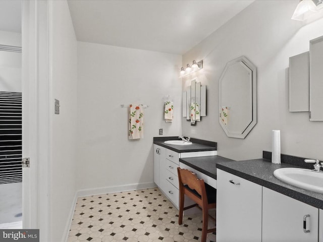  - bathroom with two vanities and baseboards