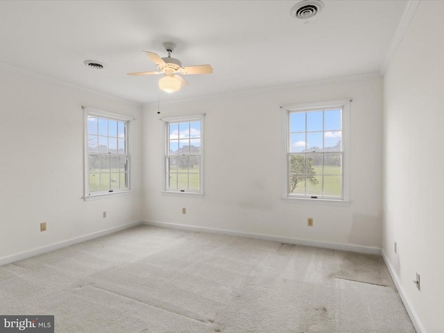  - empty room featuring crown molding, a ceiling fan, and light carpet