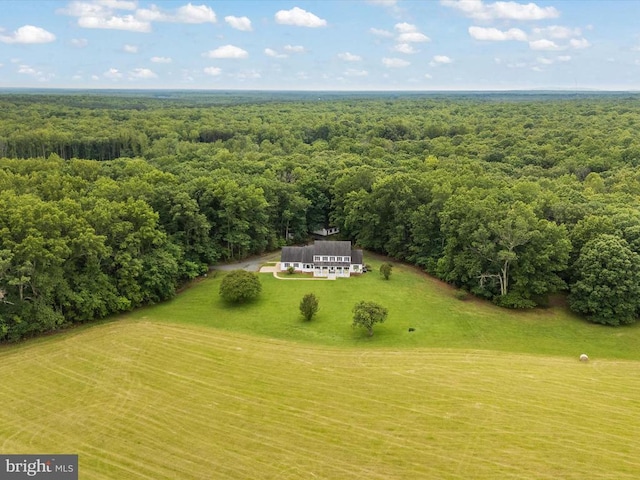  - aerial view of property and surrounding area featuring a forest