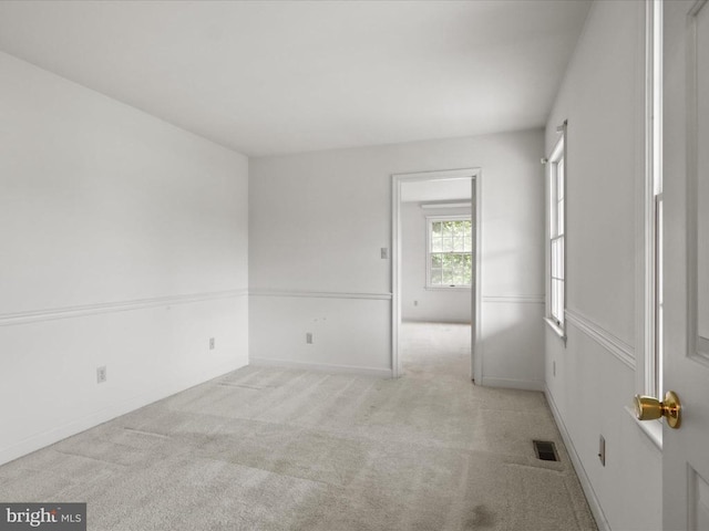  - spare room featuring carpet floors and baseboards