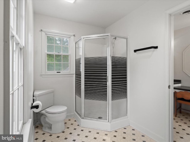  - bathroom featuring a stall shower and tile patterned floors