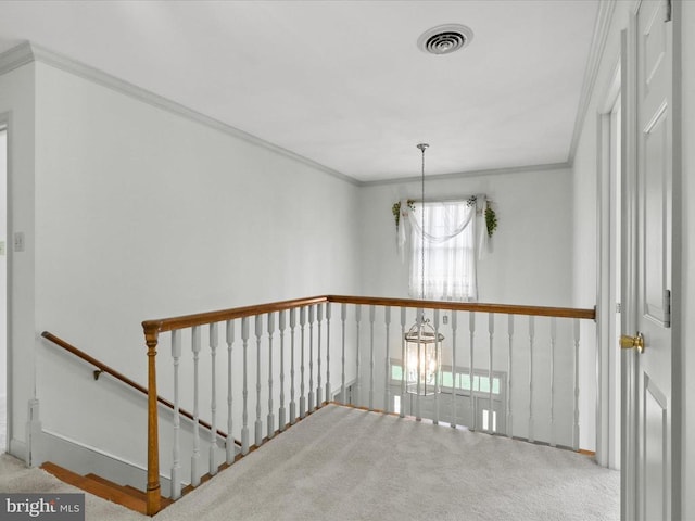  - hallway featuring an upstairs landing, carpet, crown molding, and a chandelier