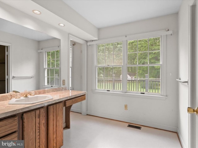 - bathroom featuring vanity and recessed lighting