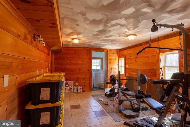 18075 Safe Haven Way, Culpeper, VA 22701 - exercise area with washer / clothes dryer, healthy amount of natural light, wood walls, and tile patterned flooring