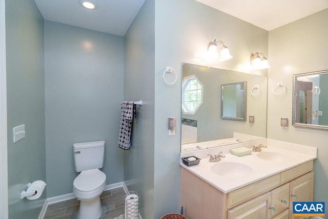 895 Jefferson Dr, Palmyra, VA 22963 - bathroom with toilet, double vanity, baseboards, and recessed lighting