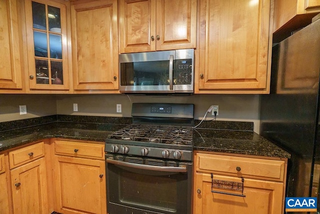 895 Jefferson Dr, Palmyra, VA 22963 - kitchen with appliances with stainless steel finishes, glass insert cabinets, and dark stone countertops