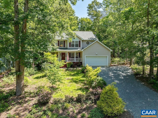 895 Jefferson Dr, Palmyra, VA 22963 - view of front facade with covered porch, asphalt driveway, and a garage