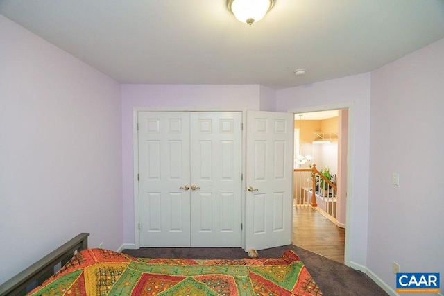 895 Jefferson Dr, Palmyra, VA 22963 - bedroom featuring dark colored carpet, baseboards, and a closet