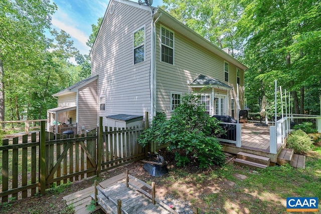895 Jefferson Dr, Palmyra, VA 22963 - rear view of property featuring a wooden deck, a fenced backyard, and a gate