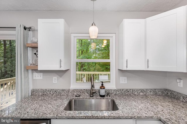 6217 Oak Grove Dr, Fredericksburg, VA 22407 - kitchen featuring white cabinetry, open shelves, decorative light fixtures, light stone counters, and a textured ceiling