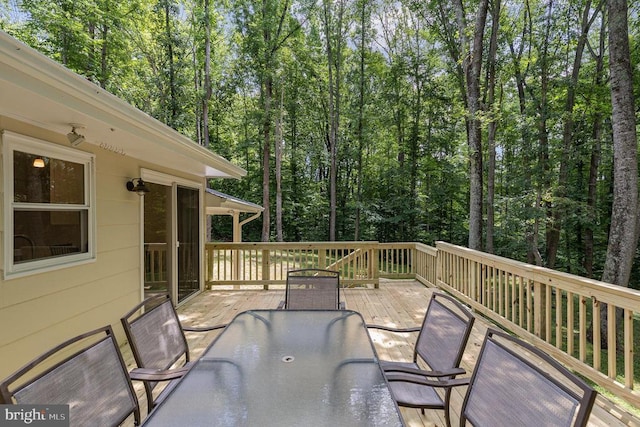 6217 Oak Grove Dr, Fredericksburg, VA 22407 - deck with outdoor dining space and a forest view