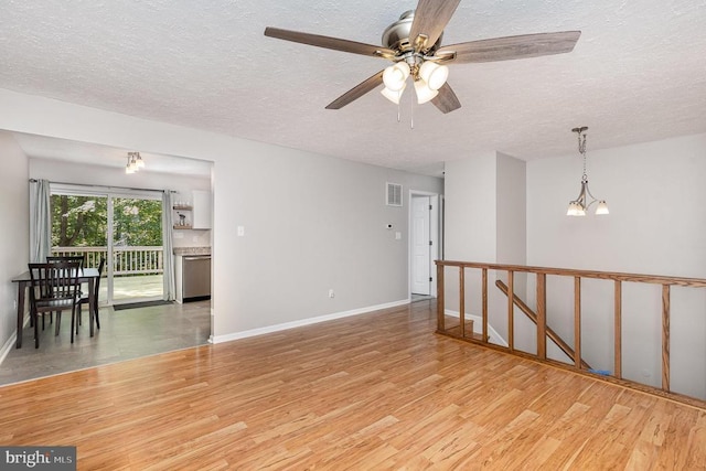 6217 Oak Grove Dr, Fredericksburg, VA 22407 - empty room with wood finished floors, a textured ceiling, and ceiling fan