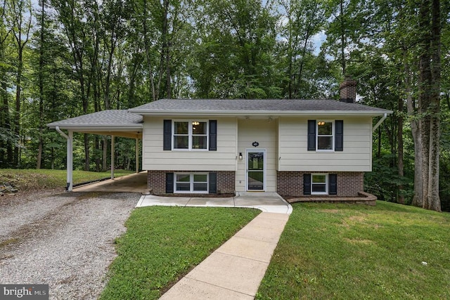 6217 Oak Grove Dr, Fredericksburg, VA 22407 - split foyer home featuring driveway, a chimney, a carport, a front yard, and brick siding