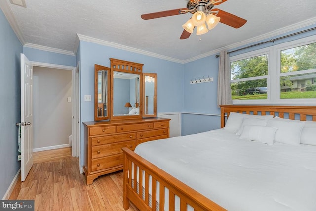 6217 Oak Grove Dr, Fredericksburg, VA 22407 - bedroom featuring light wood-style floors, crown molding, ceiling fan, and a textured ceiling