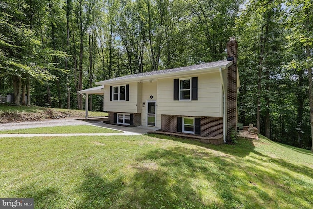 6217 Oak Grove Dr, Fredericksburg, VA 22407 - raised ranch with a chimney, a front yard, and driveway