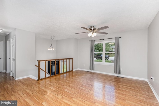 6217 Oak Grove Dr, Fredericksburg, VA 22407 - unfurnished room with light wood-style floors, a ceiling fan, and a textured ceiling