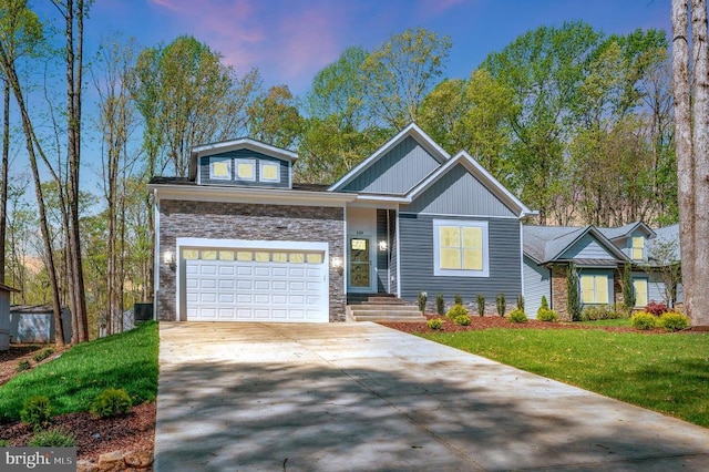 112 Edgehill Dr, Locust Grove, VA 22508 - view of front of property featuring driveway, stone siding, a garage, and a yard