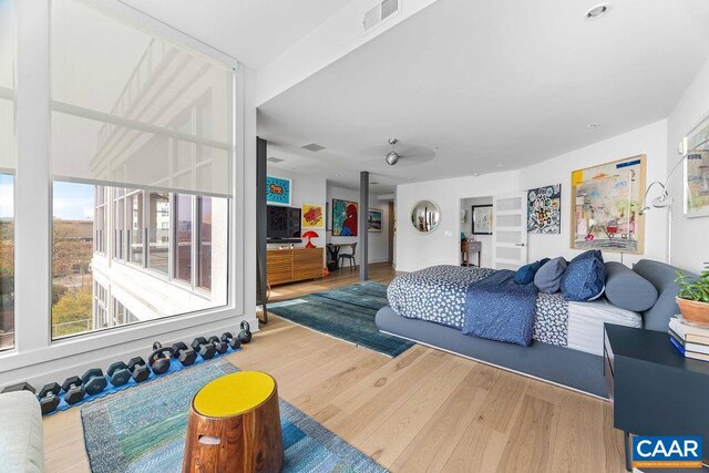 218 Water St W Unit 705, Charlottesville, VA 22902 - living area featuring visible vents and wood finished floors
