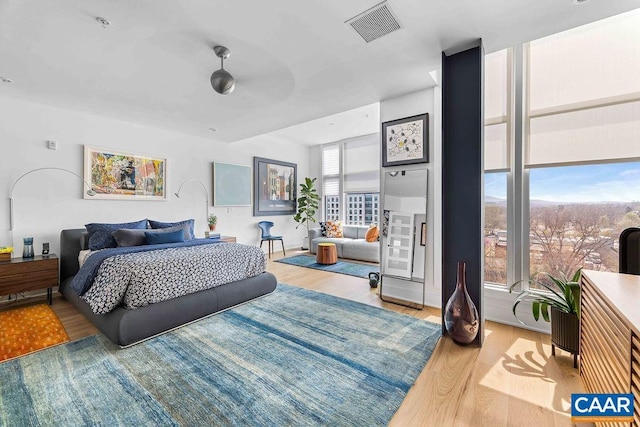 218 Water St W Unit 705, Charlottesville, VA 22902 - bedroom featuring visible vents and wood finished floors