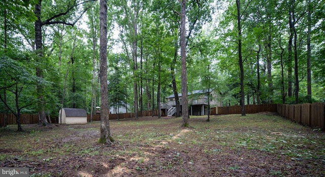 12719 Pickett Ct, Spotsylvania, VA 22551 - fenced backyard featuring a shed and stairway