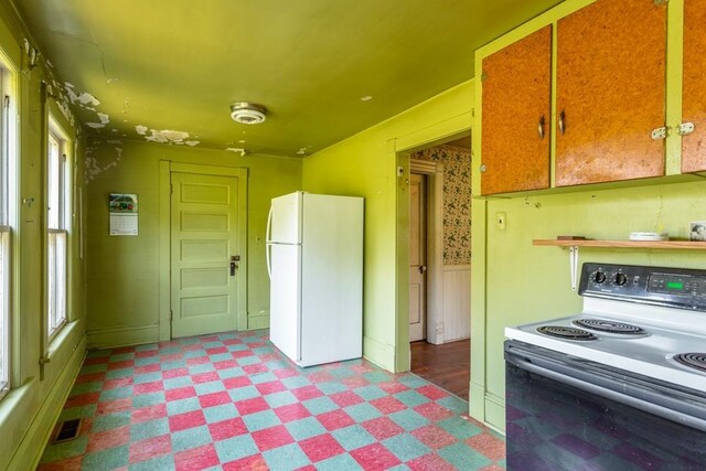 253 Church St, Timberville, VA 22853 - kitchen featuring freestanding refrigerator, light floors, visible vents, and range with electric stovetop