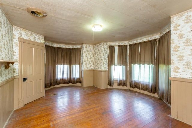 253 Church St, Timberville, VA 22853 - unfurnished room featuring hardwood / wood-style flooring, a wainscoted wall, and wallpapered walls