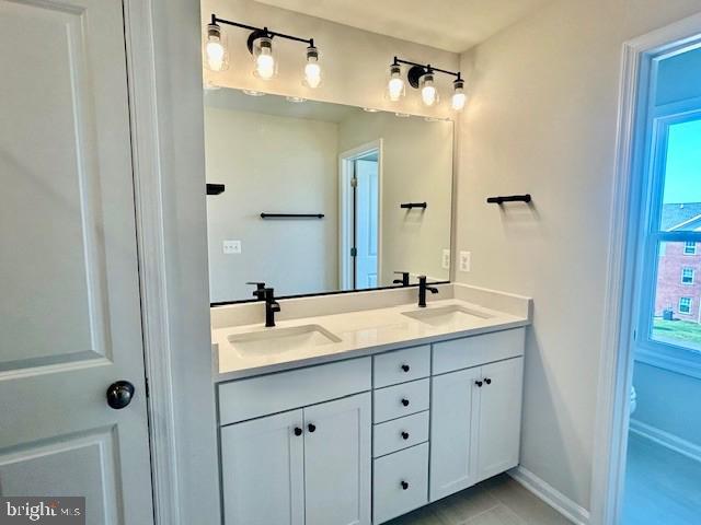 7861 Harlow Cir, Spotsylvania, VA 22551 - bathroom featuring double vanity and baseboards