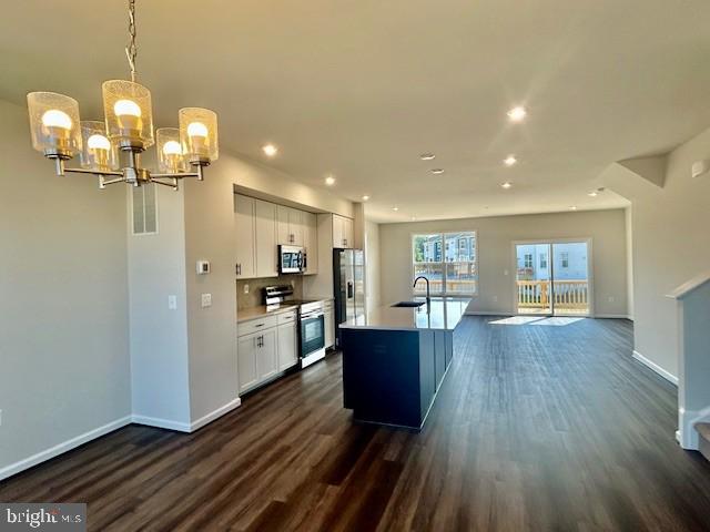 7861 Harlow Cir, Spotsylvania, VA 22551 - kitchen featuring stainless steel appliances, dark wood-type flooring, white cabinetry, recessed lighting, and light countertops