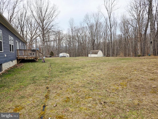 14511 Antler Rd, Fredericksburg, VA 22407 - view of green lawn featuring a shed, a wooden deck, and an outdoor structure