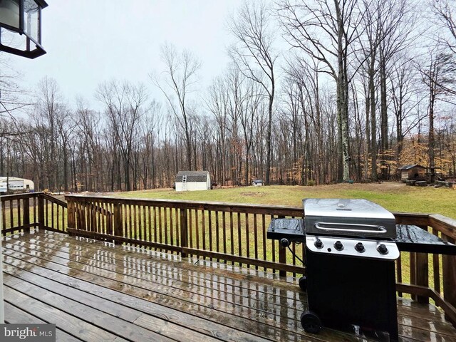 14511 Antler Rd, Fredericksburg, VA 22407 - wooden deck with a storage shed, a grill, an outdoor structure, and a yard