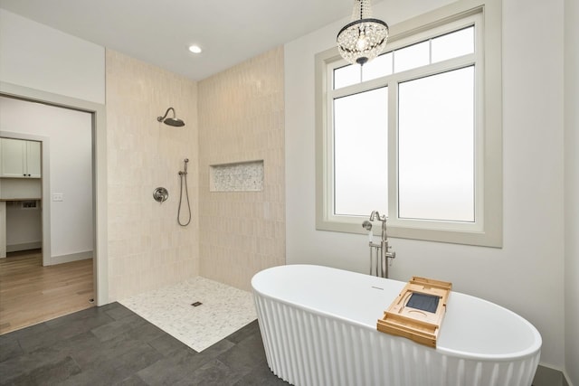 135 Radnor Ct, Rockingham, VA 22801 - bathroom with recessed lighting, baseboards, an inviting chandelier, tiled shower, and a soaking tub