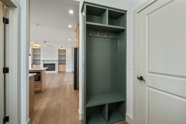 135 Radnor Ct, Rockingham, VA 22801 - mudroom with a fireplace, light wood-type flooring, a ceiling fan, and recessed lighting