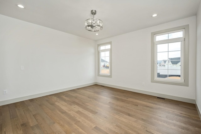 135 Radnor Ct, Rockingham, VA 22801 - unfurnished room with a chandelier, light wood-style flooring, visible vents, and recessed lighting