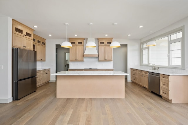 135 Radnor Ct, Rockingham, VA 22801 - kitchen featuring a sink, premium range hood, decorative backsplash, a kitchen island, and appliances with stainless steel finishes