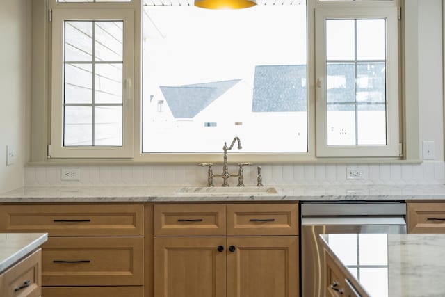 135 Radnor Ct, Rockingham, VA 22801 - kitchen featuring stainless steel dishwasher, light stone countertops, and a sink