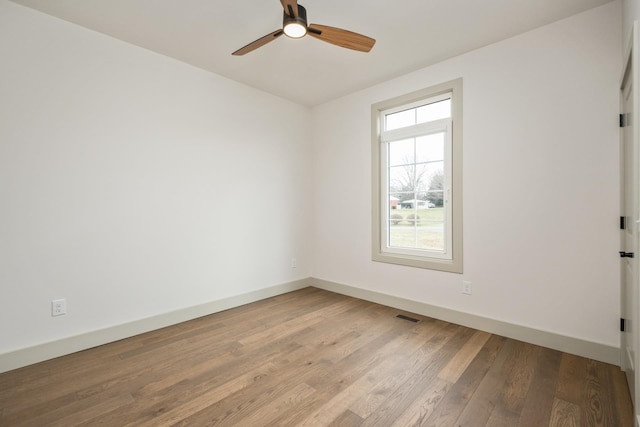 135 Radnor Ct, Rockingham, VA 22801 - spare room featuring ceiling fan, baseboards, visible vents, and wood finished floors