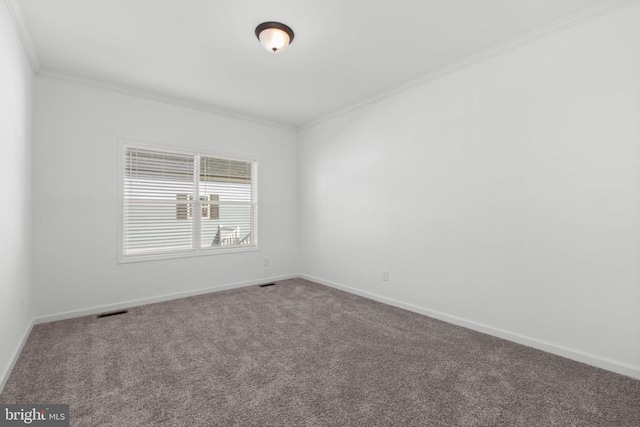 unfurnished room featuring visible vents, carpet, baseboards, and ornamental molding