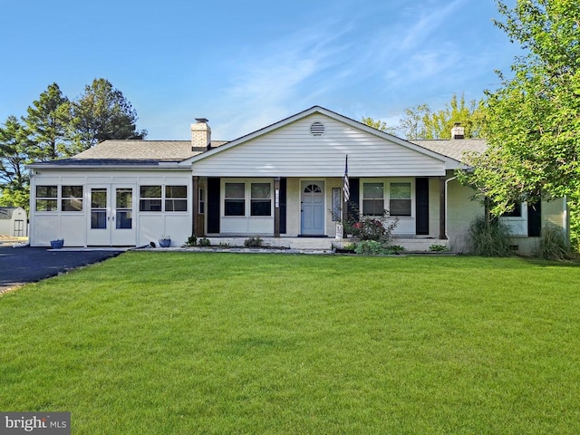 7615 Morris Rd, Spotsylvania, VA 22551 - ranch-style house with a chimney, a front yard, a shingled roof, and covered porch